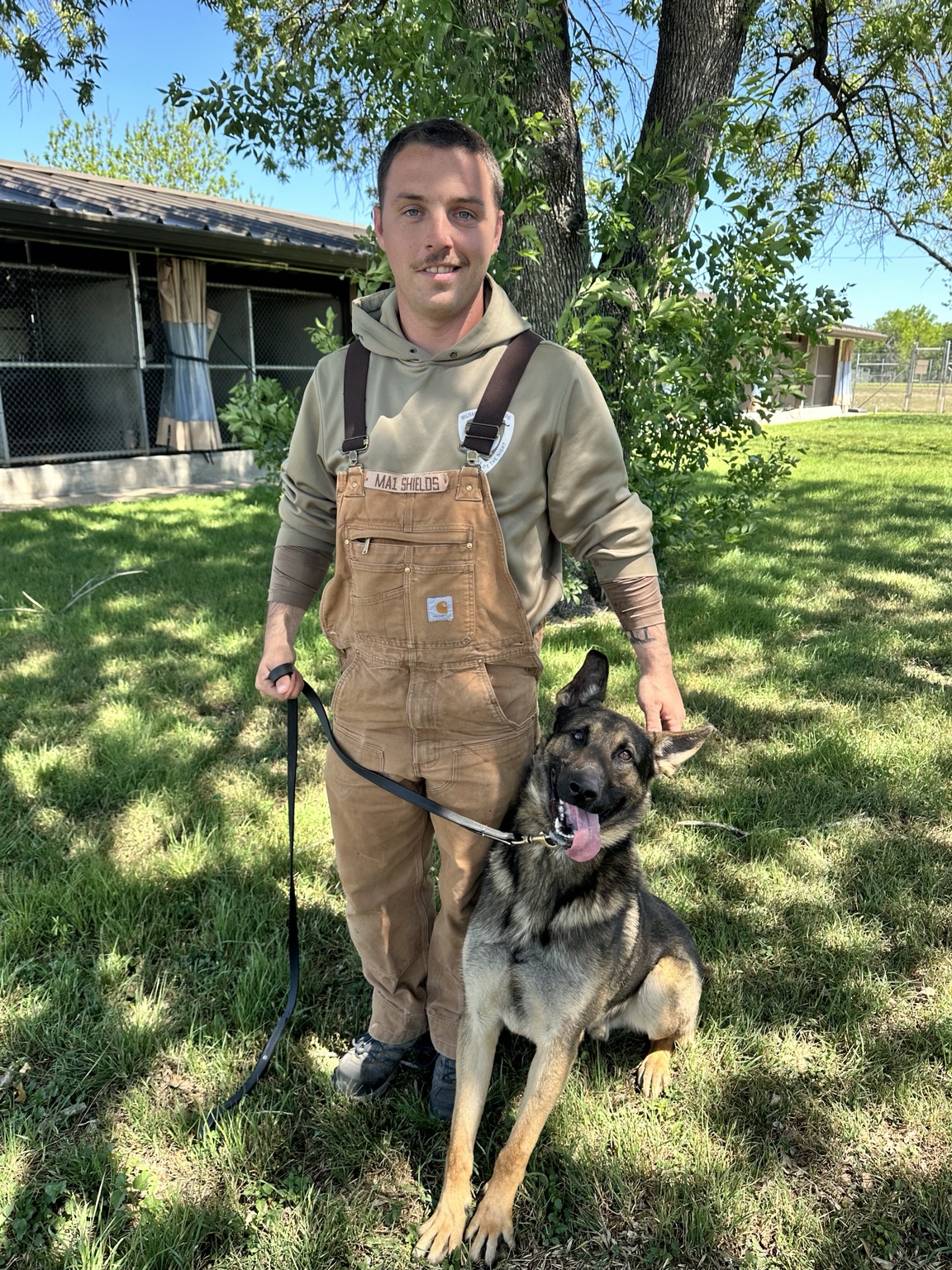 Kyle Shields with a working dog